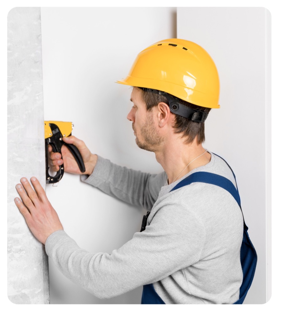 Handyman working safely inside a home